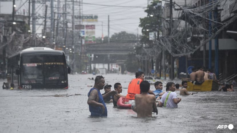Streets turned into rivers as Typhoon Gaemi blows past Philippines Streets turned into rivers as Typhoon Gaemi blows past Philippines